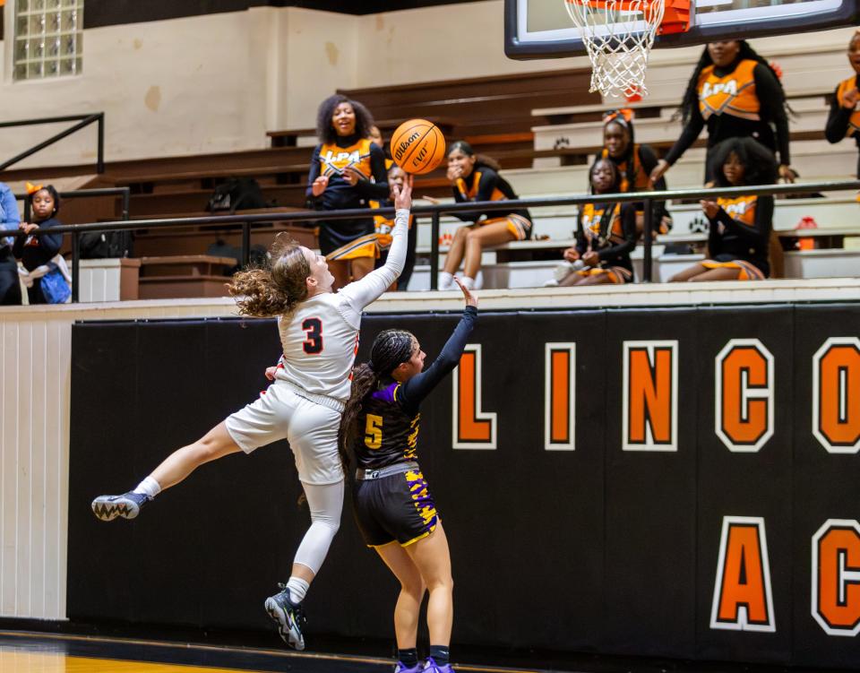 Olivia Titherington (3), of Lincoln Park Academy, goes for a jump shot against Boynton Beach in a girls basketball Region 4-5A semifinal at Lincoln Park Academy on Monday, Feb. 19, 2024, in Fort Pierce.
