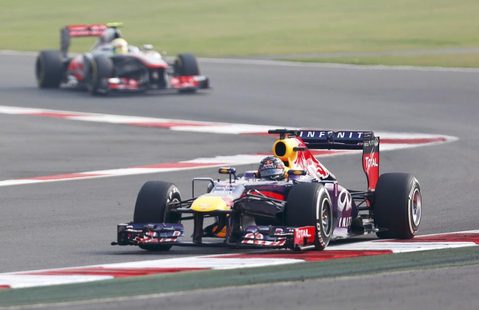 Red Bull Formula One driver Sebastian Vettel of Germany drives during the qualifying session of the Indian F1 Grand Prix at the Buddh International Circuit in Greater Noida, on the outskirts of New Delhi, October 26, 2013. REUTERS/Ahmad Masood (INDIA - Tags: SPORT MOTORSPORT F1)