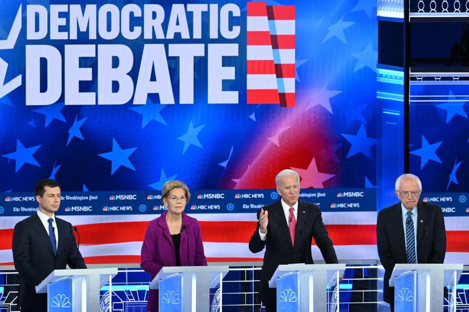 Democratic presidential hopefuls (L-R) Mayor of South Bend, Indiana, Pete Buttigieg, Massachusetts Senator Elizabeth Warren, Former Vice President Joe Biden and Vermont Senator Bernie Sanders speak during the fifth Democratic primary debate of the 2020 presidential campaign season co-hosted by MSNBC and The Washington Post at Tyler Perry Studios in Atlanta, Georgia on November 20, 2019. (Photo by SAUL LOEB / AFP) (Photo by SAUL LOEB/AFP via Getty Images)