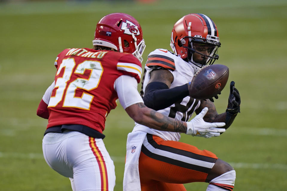 Kansas City Chiefs safety Tyrann Mathieu, left, breaks up a pass intended for Cleveland Browns wide receiver Jarvis Landry, right, during the second half of an NFL divisional round football game, Sunday, Jan. 17, 2021, in Kansas City. (AP Photo/Jeff Roberson)