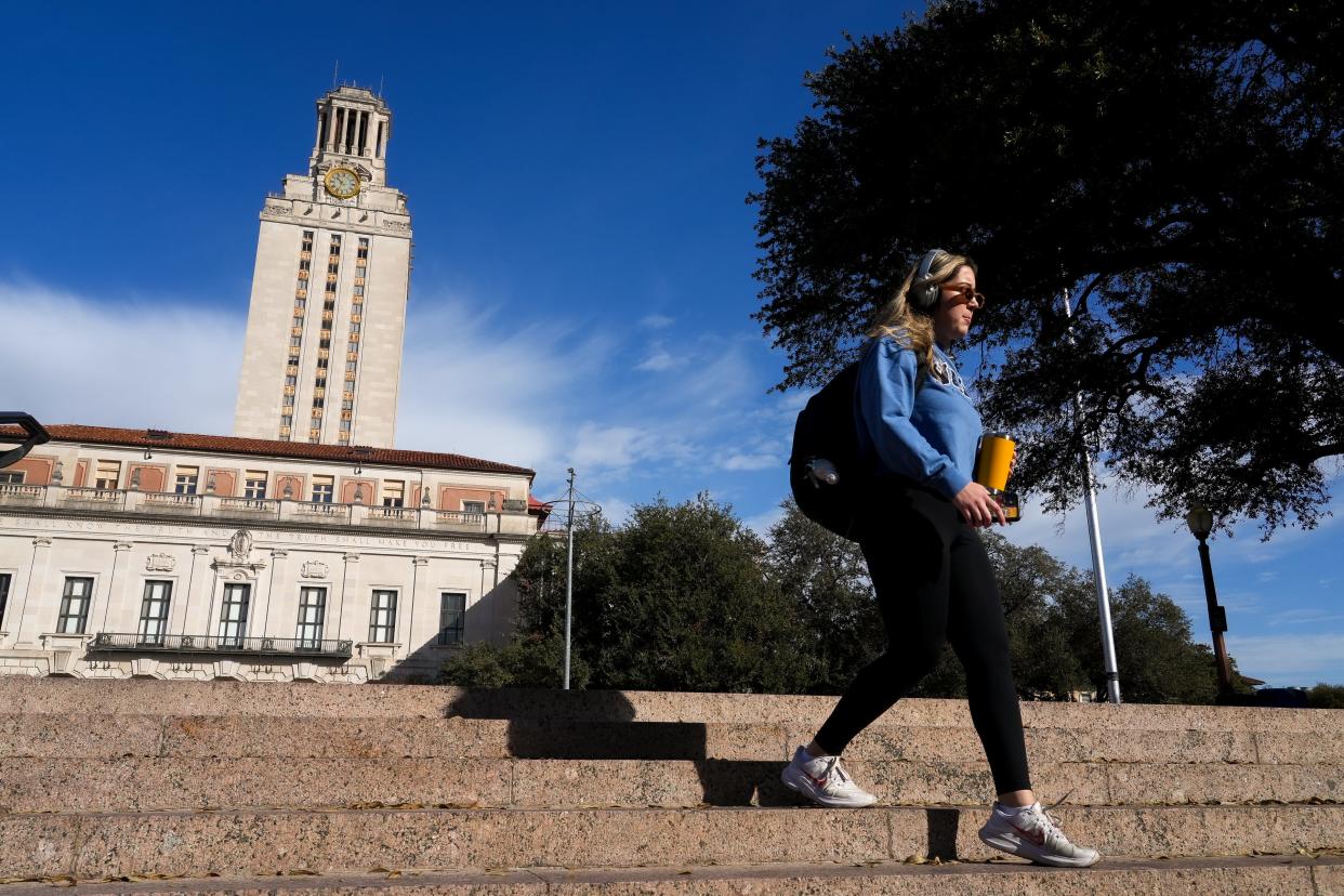 A University of Texas at Austin student walks down the stairs in front of UT Tower on the first day of the spring semester Monday, Jan. 9, 2023 in Austin. This session, lawmakers passed several bills that will affect Texas students and faculty members at the state's public higher education institutions.
