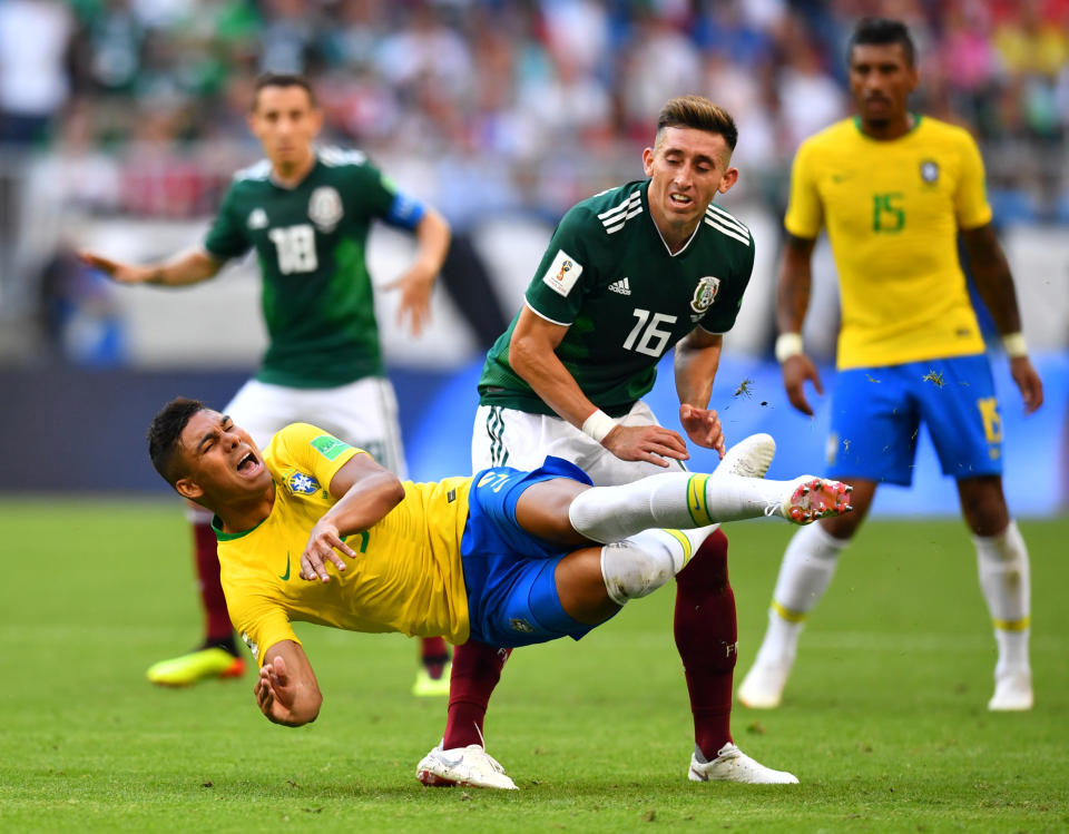 <p>Brazil’s Casemiro in action with Mexico’s Hector Herrera REUTERS/Dylan Martinez </p>