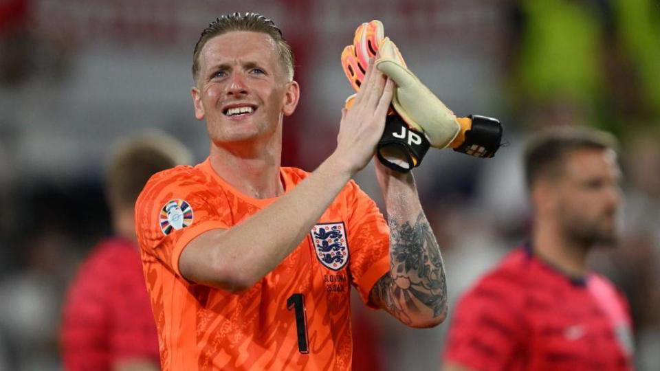 Jordan Pickford applauds England fans