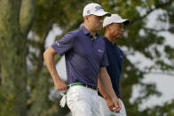 Justin Thomas, of the United States, and Tiger Woods, of the United States, walk off the second tee during the first round of the US Open Golf Championship, Thursday, Sept. 17, 2020, in Mamaroneck, N.Y. (AP Photo/John Minchillo)