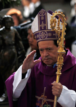 FILE PHOTO: Cardinal Norberto Rivera attends the Ash Wednesday mass at the Metropolitan Cathedral in Mexico City February 13, 2013. REUTERS/Tomas Bravo/File Photo