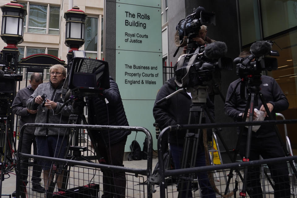 Media waits outside the High Court for the expected arrival of Prince Harry in London, Monday, June 5, 2023. Prince Harry has five active legal cases, three of them involving his battle with the British tabloids. He is expected to testify in London's High Court; if he takes the witness stand, he'll be the first member of the royal family to testify in court since the late 19th century. (AP Photo/Alberto Pezzali)