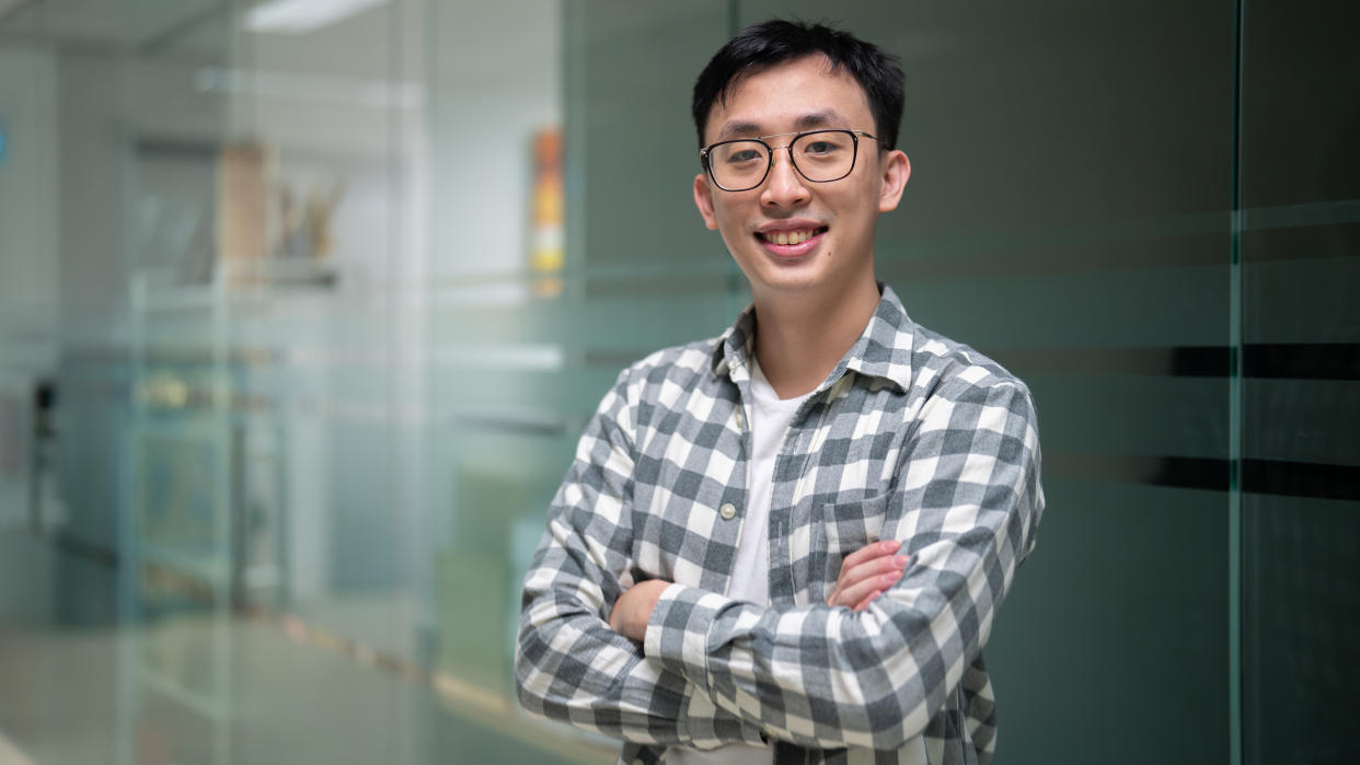 Edmund Chong, entrepreneur and founder of HustleVenture, posing with arms crossed.