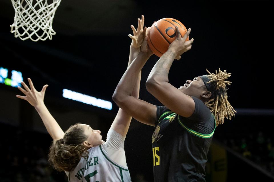 Oregon center Phillipina Kyei is fouled by Portland State forward Lana Wenger as the Oregon Ducks host Portland State Saturday, Dec. 9, 2023, at Matthew Knight Arena in Eugene, Ore.