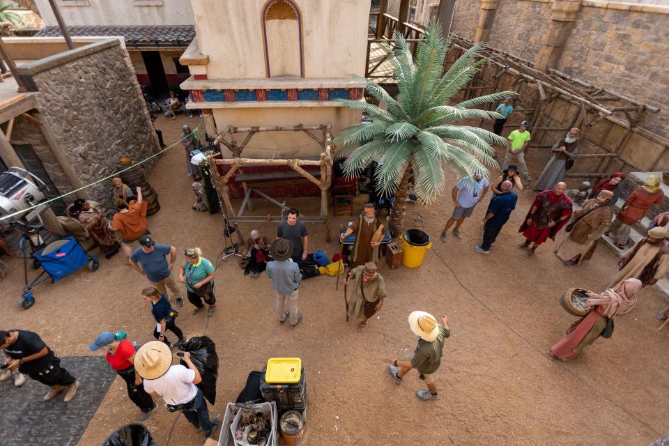 Extras and crew members for “The Chosen” prepare to film on the Biblical first-century set.