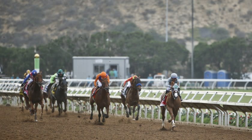 California Chrome flies down the closing stretch leaving the competition in his wake during the running of the Pacific Classic at Del Mar Thoroughbred Club Saturday, Aug. 20, 2016, in Del Mar, Calif. (AP Photo/Lenny Ignelzi)