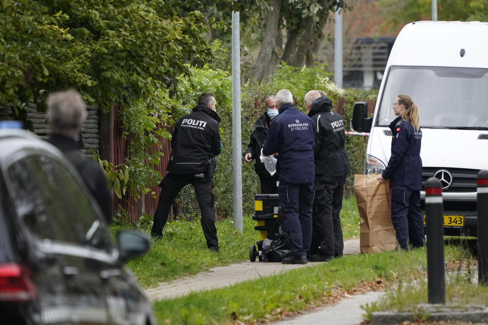 Police officers attend the scene after Peter Madsen was apprehended following a failed escape attempt in Albertslund, Denmark, Tuesday Oct. 20, 2020. The self-taught Danish engineer, who was convicted of torturing and murdering a Swedish journalist on his homemade submarine in 2017 before dismembering her body and dumping it at sea, on Tuesday was captured after attempted prison escape outside the suburban Copenhagen jail where he is serving life-time sentence. (Mads Claus Rasmussen/Ritzau Scanpix via AP)