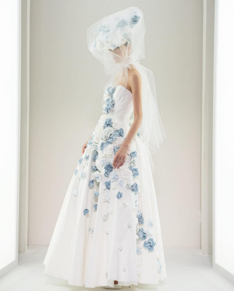 The white denim gown features blue 3D flowers. (Photo: Courtesy)