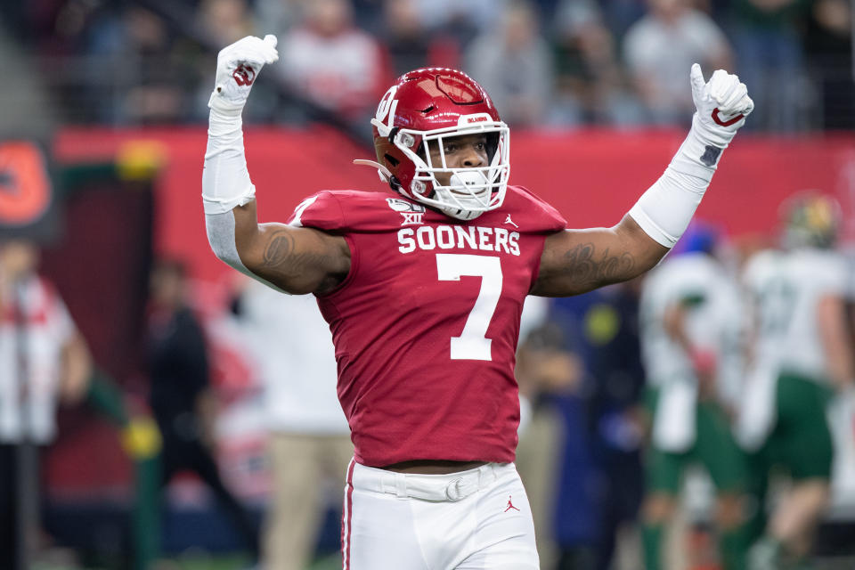 Oklahoma pass rusher Ronnie Perkins tries to fire up the crowd during the Big 12 championship game. (Photo by Matthew Visinsky/Icon Sportswire via Getty Images).