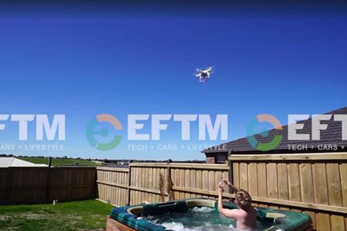 The man can be seen waiting in his hot tub as his sausage-carrying drone delivers the goods. Photo: Facebook