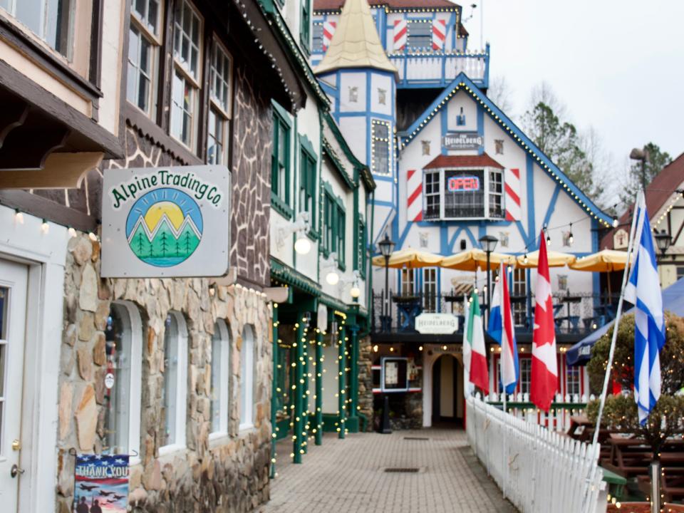 Colorful buildings surrounding a biergarten, Alison Datko, ":I visited a small mountain town in Georgia, where the German-inspired architecture made me feel transported to Europe. "