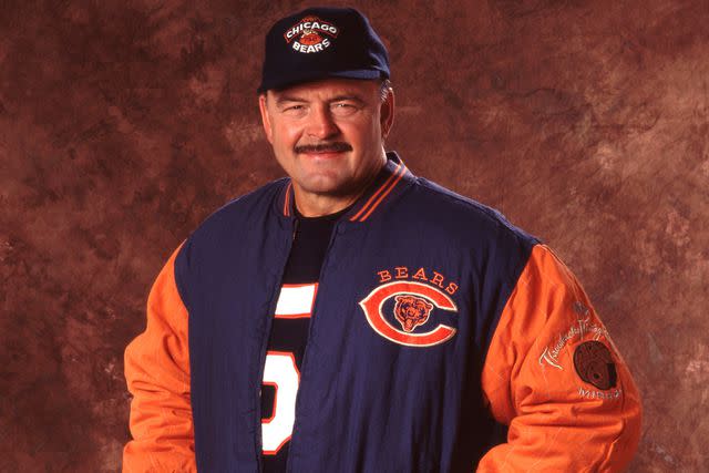 <p>Paul Spinelli via AP</p> Dick Butkus poses for photos in the NFL Throwbacks retail merchandise collection