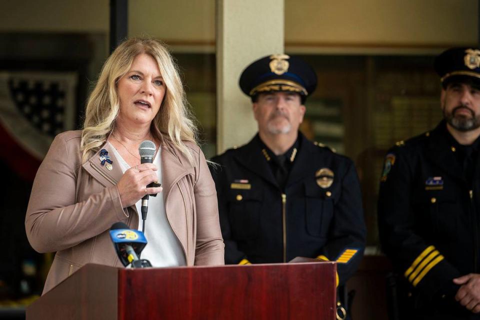 Michelle Gray speaks during an annual ceremony to honor her late husband and fallen Merced Police officer Stephan Gray, at the Merced Police Station in Merced, Calif., on Monday, April 15, 2024. Gray was shot and killed in the line of duty on April 15, 2004.