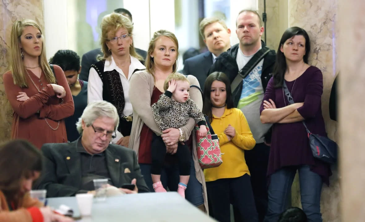Parents with their children and medical professionals listen to testimony from people who want Mississippi to allow a religious exemption from the vaccination requirements for school attendance, during a legislative committee meeting on Jan. 24, 2018, at the Capitol in Jackson, Miss. (AP Photo/Rogelio V. Solis, File)