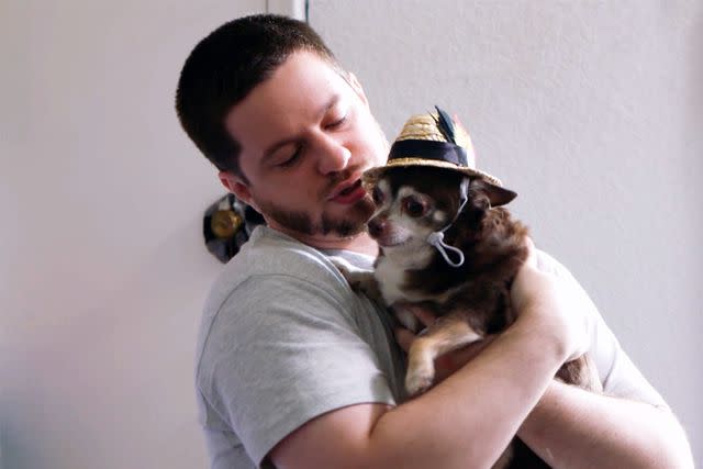 <p>TLC</p> Clayton holds his Chihuahua on 90 Day Fiancé