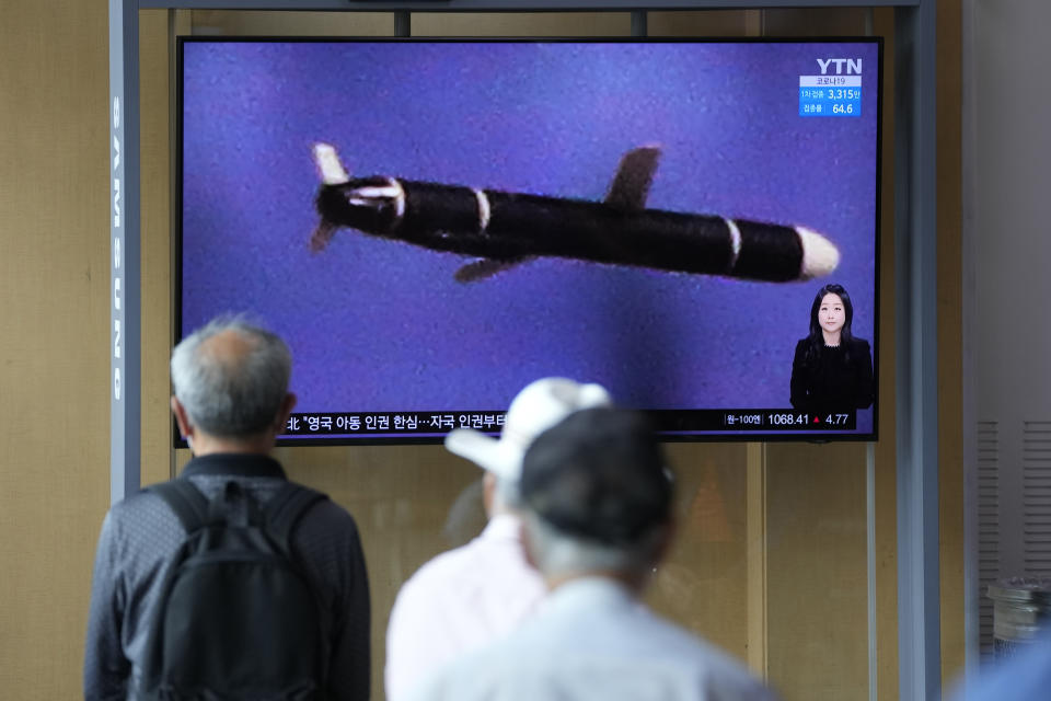 People watch a TV screen showing a news program showing a North Korean handout photo that says, "North Korea's long-range cruise missiles tests," in Seoul, South Korea, Monday, Sept. 13, 2021. North Korea says it successfully test-fired newly developed long-range cruise missiles over the weekend, its first known testing activity in months, underscoring how it continues to expand its military capabilities amid a stalemate in nuclear negotiations with the United States. (AP Photo/Lee Jin-man)