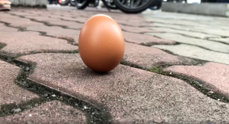 An egg is seen on the ground in Shah Alam, Kuala Lumpur