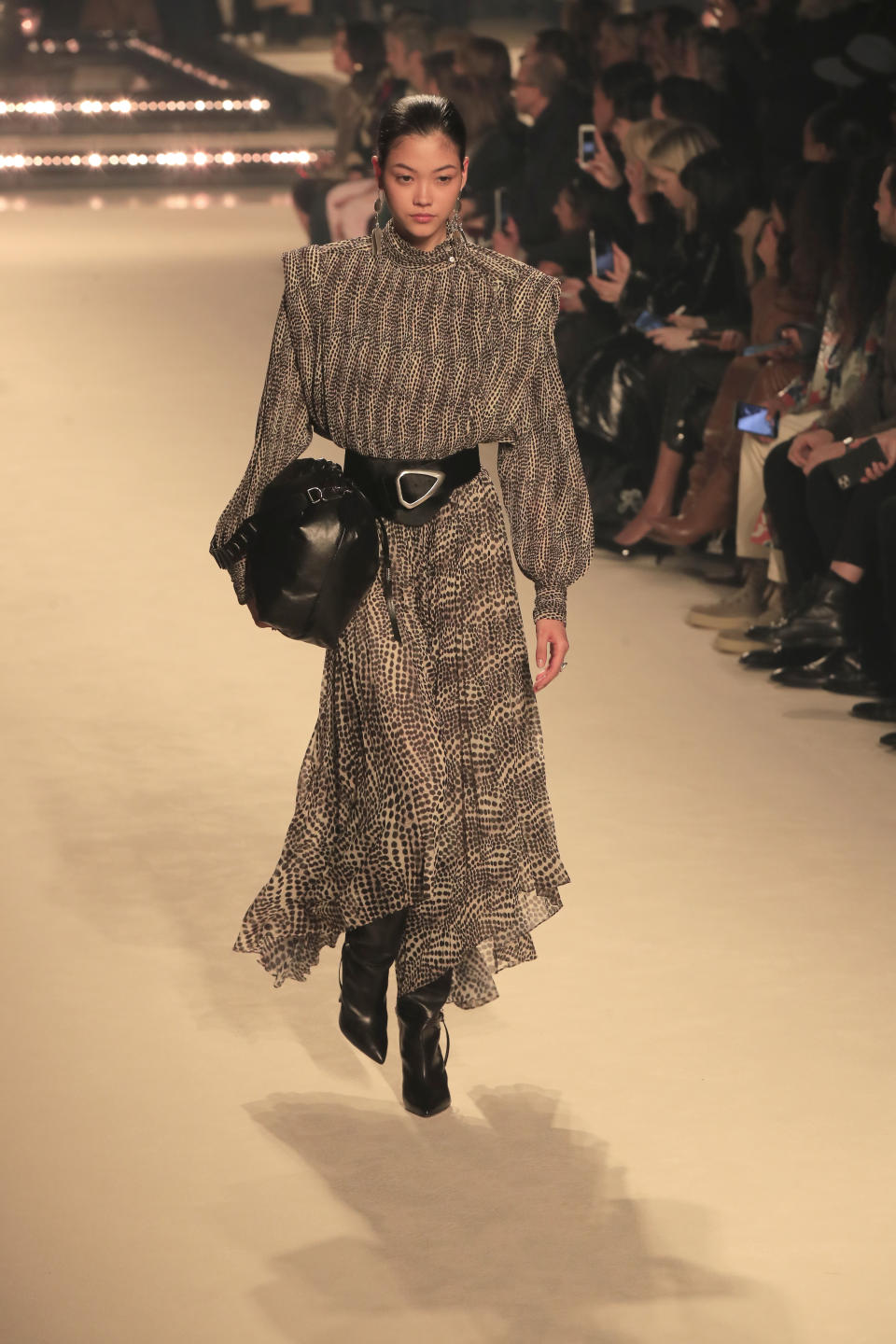 A model wears a creation for the Isabel Marant fashion collection during Women's fashion week Fall/Winter 2020/21 presented in Paris, Thursday, Feb. 27, 2020. (AP Photo/Michel Euler)