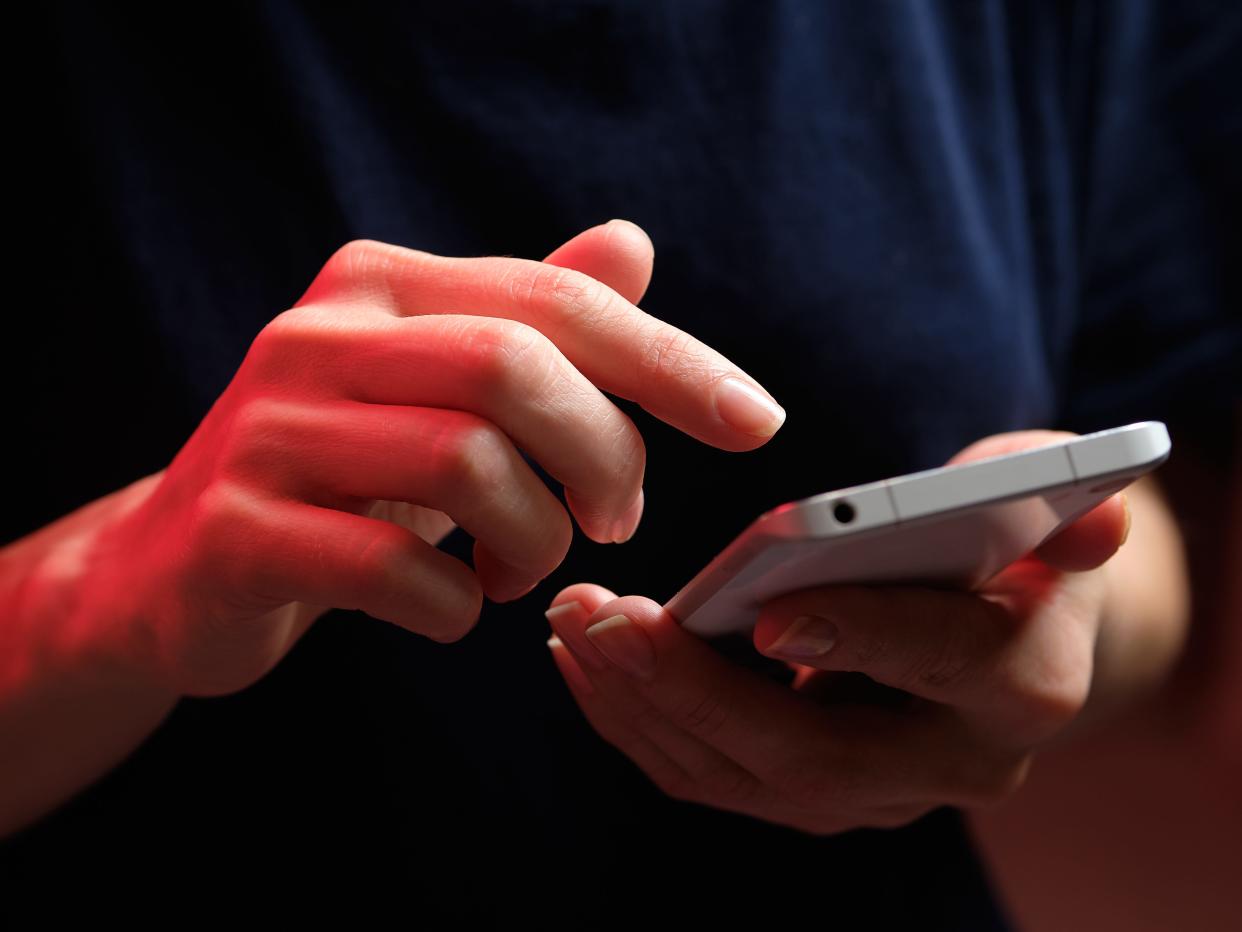 A woman uses a cellphone