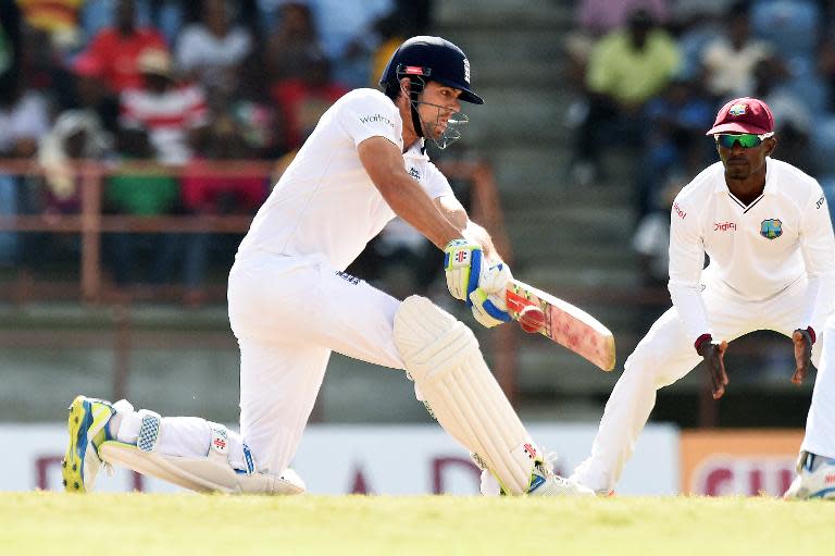 England's cricket team captain Alastair Cook plays a shot during the final day of the second Test cricket match between the West Indies and England in Saint George's on April 25, 2015