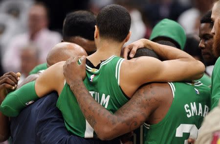 Oct 17, 2017; Cleveland, OH, USA; Boston Celtics players hold each other after forward Gordon Hayward injured his ankle during the first half against the Cleveland Cavaliers at Quicken Loans Arena. Mandatory Credit: Ken Blaze-USA TODAY Sports