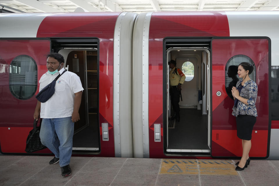 A man walks out from a high-speed train during a test ride at Tegalluar station in Bandung, West Java province, Indonesia, on Sept. 18, 2023. Indonesia is launching Southeast Asia’s first high-speed railway, a key project under China’s Belt and Road infrastructure initiative that will cut travel time between the capital and another major city from the current three hours to about 40 minutes. (AP Photo/Achmad Ibrahim)