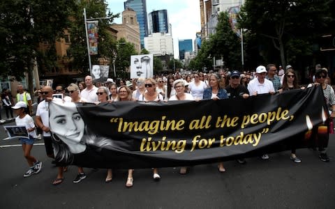 Several hundred people took part in a silent memorial march for Grace Millane through Auckland city centre  - Credit: Phil Walter/Getty Images