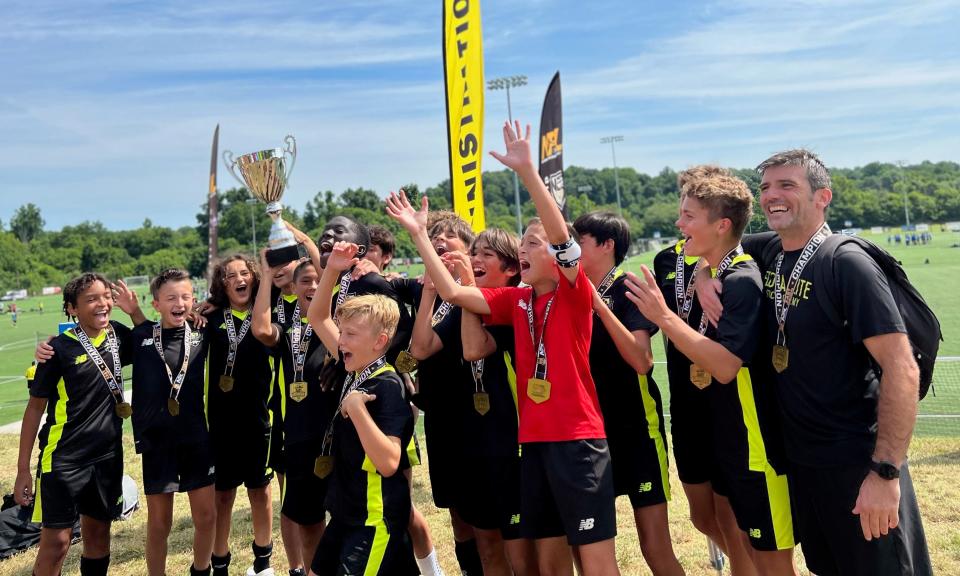 2009 Tallahassee Boys Florida Elite Soccer Academy celebrates with trophy after defeating Charleston 4-2 in NPL East Championship Game