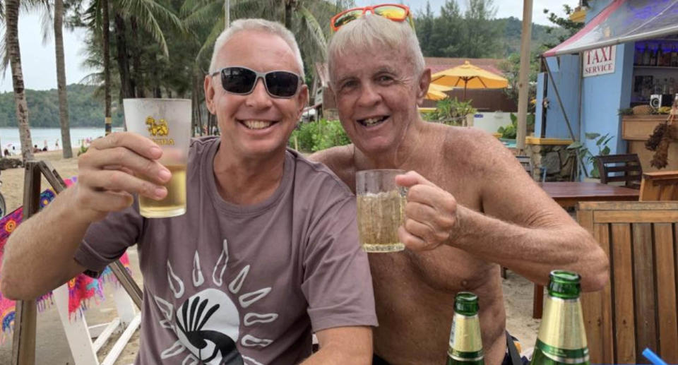 Peter Heppell with another man drinking a beer.