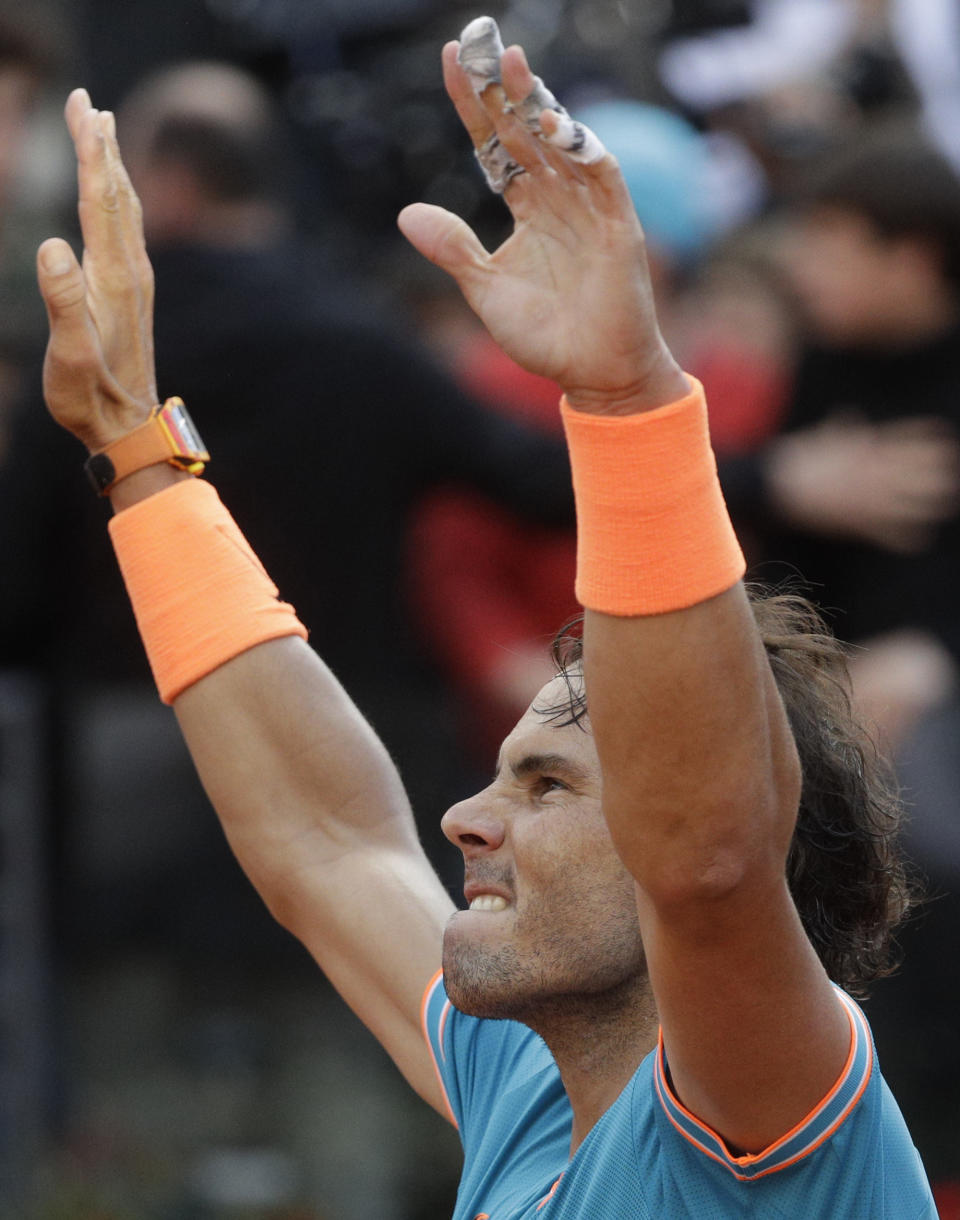 Rafael Nadal of Spain celebrates winning against Novak Djokovic of Serbia at the end of their final match at the Italian Open tennis tournament, in Rome, Sunday, May 19, 2019. (AP Photo/Gregorio Borgia)