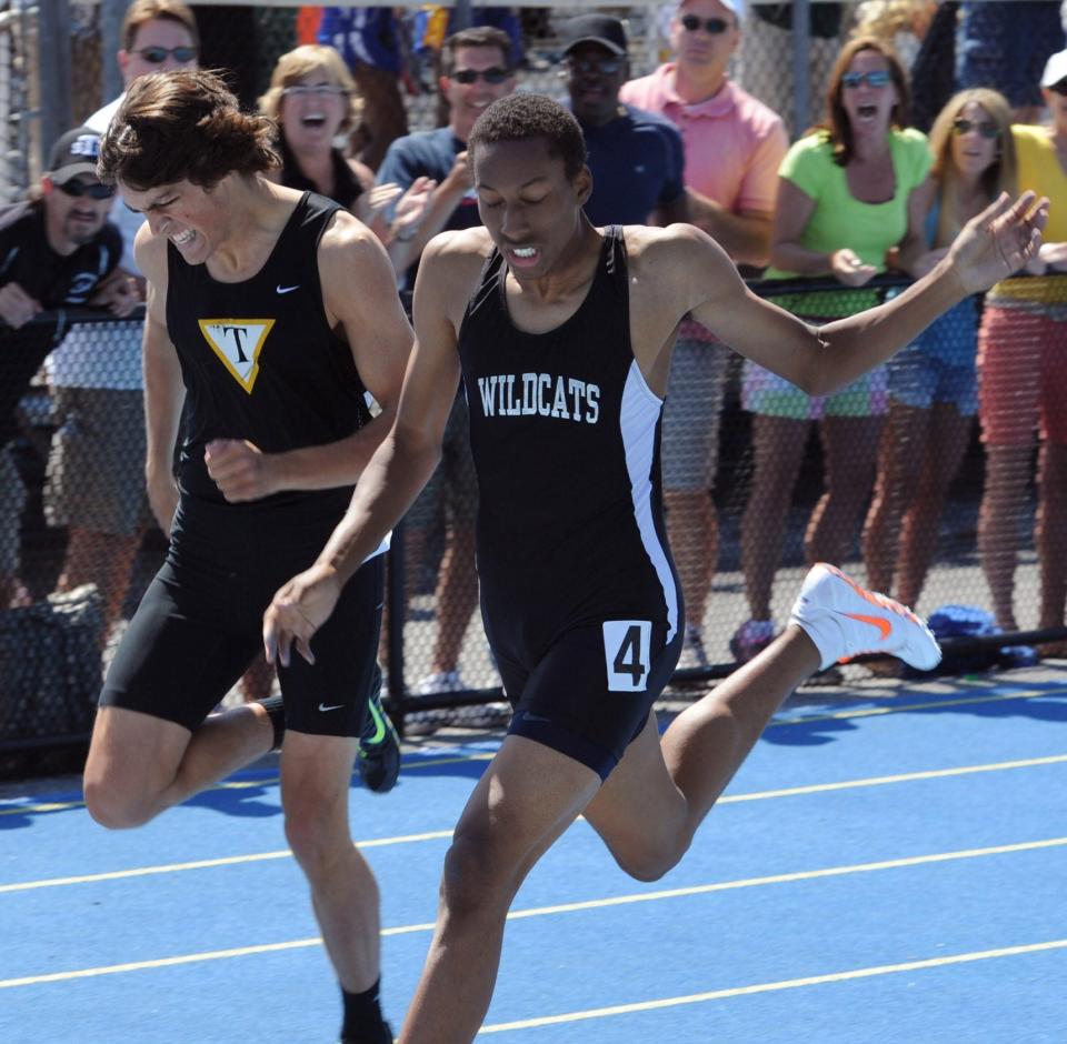 Lamar Bruton of Howard Tech (right) edges Tatnall's David Huffman at the wire in boys Division 2 400 meter dash at the state meet in 2012.