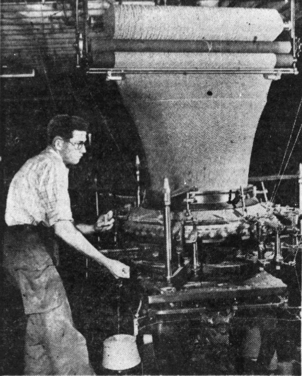 Thomas Fitzgibbon attends the knitting machine at the Binghamton Knitting Company in 1950.