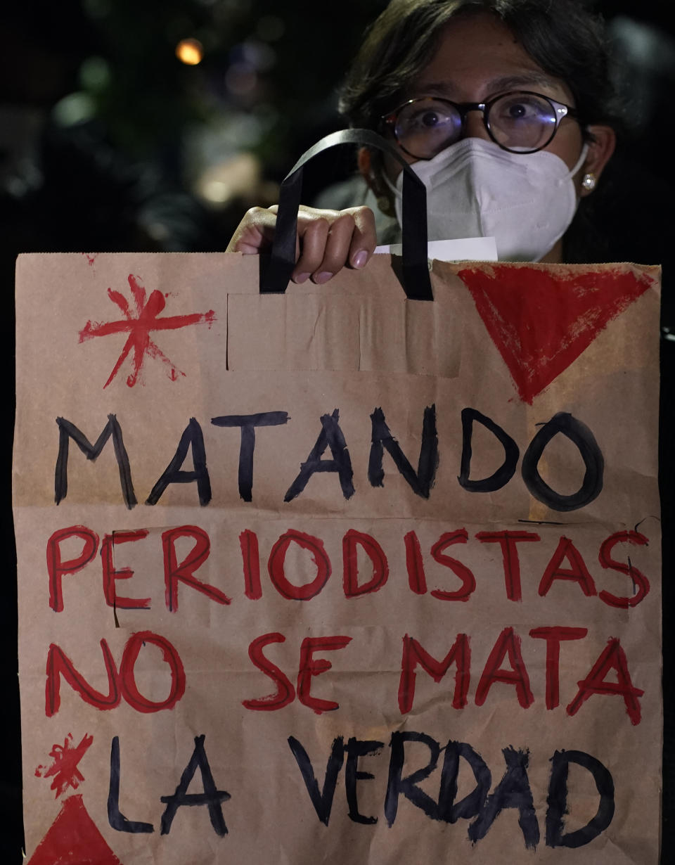A woman holds a sign that reads in Spanish "You do not kill the truth by killing journalists," during a national protest against the murder of journalist Lourdes Maldonado and freelance photojournalist Margarito Martínez, in Mexico City, Tuesday, Jan. 25, 2022. Mexico's Interior Undersecretary Alejandro Encinas said recently that more than 90% of murders of journalists and rights defenders remain unresolved, despite a government system meant to protect them. (AP Photo/Eduardo Verdugo)