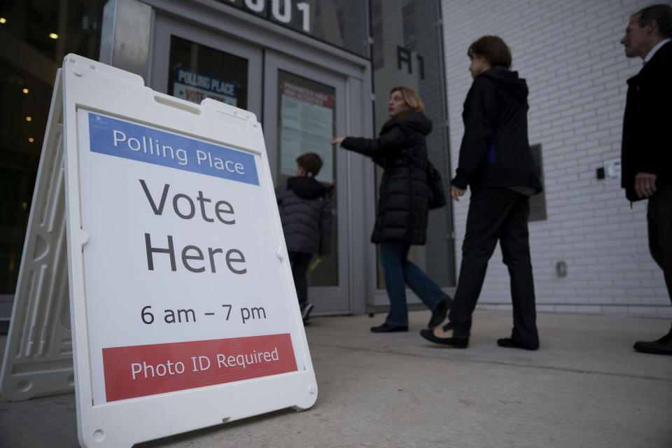 ARLINGTON, March 3, 2020  -- Voters walk into a polling station during the Virginia primary in Arlington, Virginia, the United States, March 3, 2020. Polling stations opened on the U.S. East Coast on Tuesday morning, kicking off the so-called "Super Tuesday" primaries of the 2020 presidential election. (Photo by Liu Jie/Xinhua via Getty) (Xinhua/Liu Jie via Getty Images)