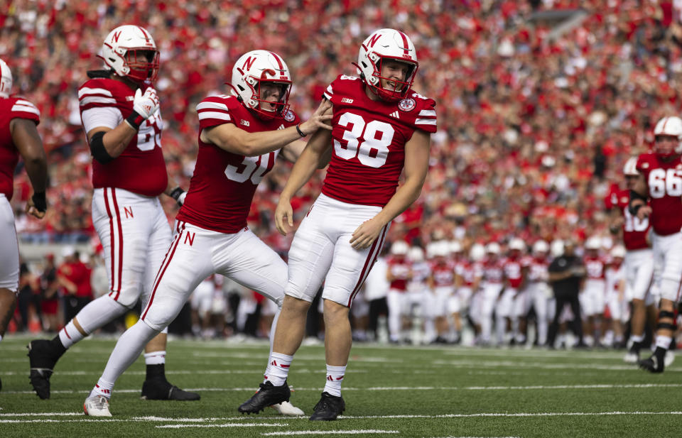 Nebraska kickers Tristan Alvano (30) and Timmy Bleekrode (38) celebrate after successfully faking a field goal attempt to make a first down against Louisiana Tech during the first half of an NCAA college football game, Saturday, Sept. 23, 2023, in Lincoln, Neb. (AP Photo/Rebecca S. Gratz)
