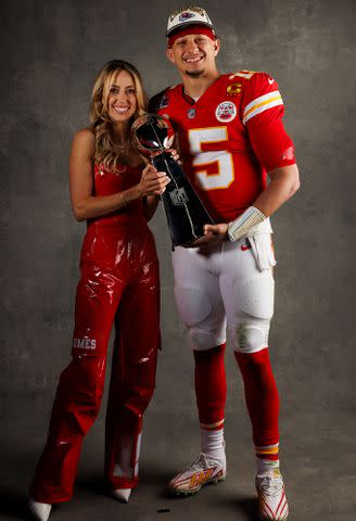 <p>Ryan Kang/Getty</p> Patrick Mahomes and Brittany Mahomes pose for a portrait with the Vince Lombardi Trophy after Super Bowl LVIII against the San Francisco 49ers at Allegiant Stadium on February 11, 2024.