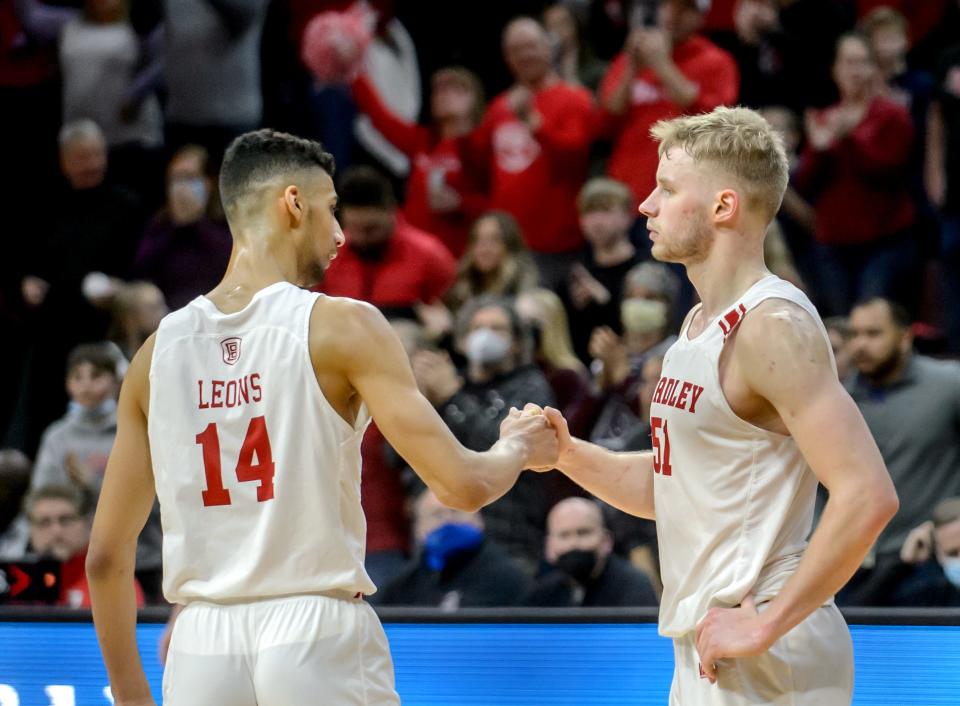 Bradley's Malevy Leons, left, and Rienk Mast shake hands as time runs out on the Braves' 68-59 victory over Drake on Saturday, Feb. 19, 2022 at Carver Arena in Peoria.