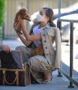 <p>Olivia Culpo snuggles her tiny new pooch outside a veterinary office in L.A. on Friday.</p>