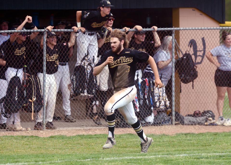 Travis Davis comes home on Arik Lumbatis' triple during the third inning of River View's 12-8 win against Minerva in a Division II sectional game on Saturday at Ron Tisko Field. The Black Bears scored 10 unanswered runs after falling behind 6-2.