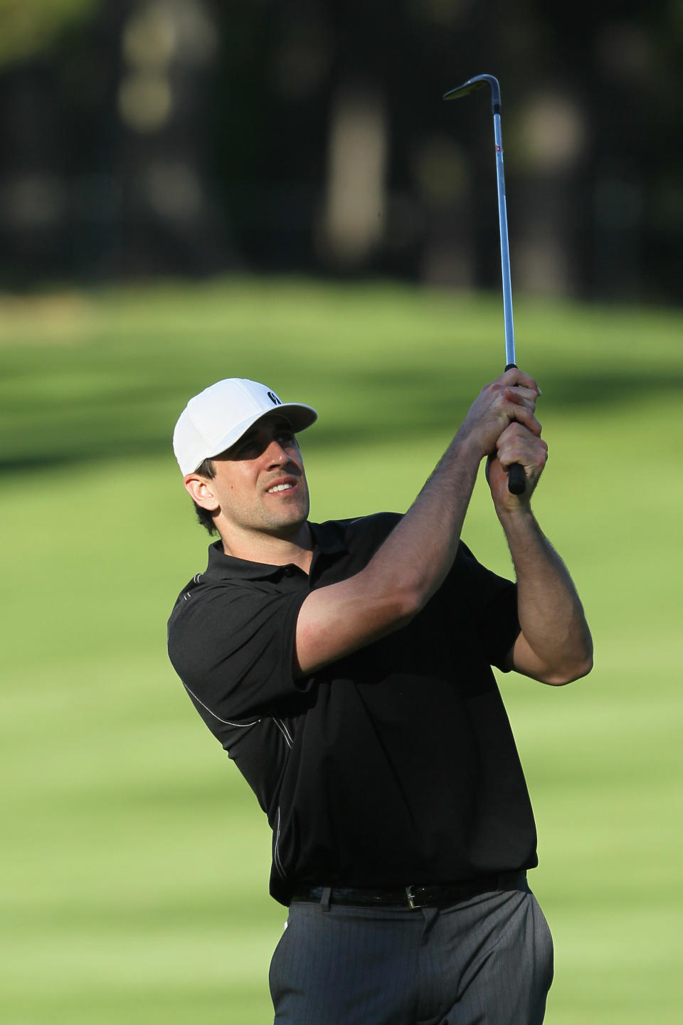 PEBBLE BEACH, CA - FEBRUARY 09: American football player Aaron Rodgers hits his second shot on the 17th hole during the AT&T Pebble Beach National Pro-Am at the Spyglass Hill Golf on February 9, 2012 in Pebble Beach, California. (Photo by Jeff Gross/Getty Images)