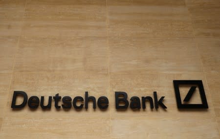 The logo of Deutsche Bank is pictured on a company's office in London