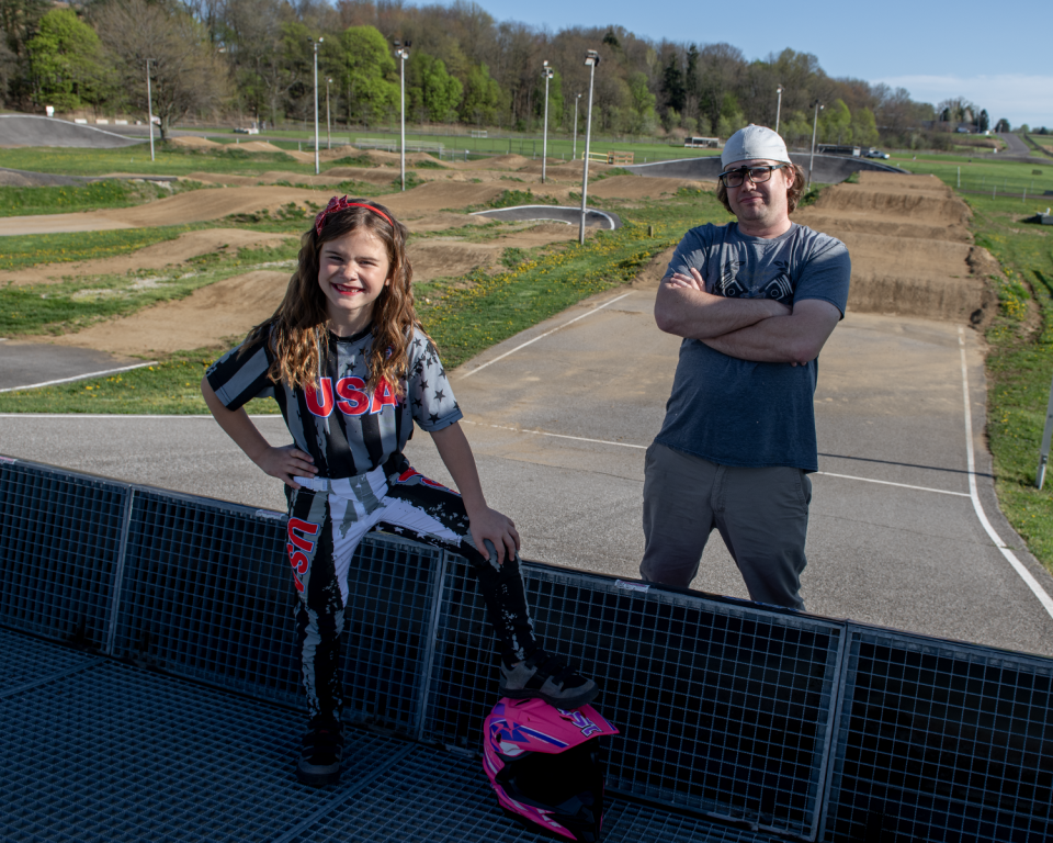 Mia Colston, 7, and her coach, Zach Quick, at Akron BMX on Thursday, April 18.