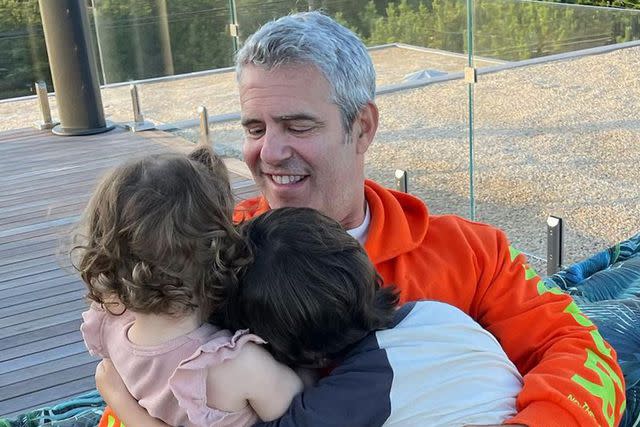 <p>Andy Cohen/Instagram</p> Andy Cohen hugs daughter Lucy and son Ben