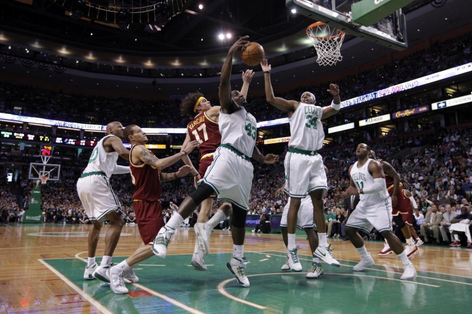 Boston Celtics forward Glen Davis (11) and forward Paul Pierce (34) work for the rebound against Cleveland Cavaliers forward Anderson Varejao (17) during the first half in game four of the Eastern Conference semifinals in the 2010 NBA playoffs at the TD Garden. David Butler II-USA TODAY Sports