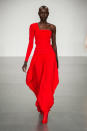 <p><i>A model wears a one-shoulder crimson-red gown. (Photo: ImaxTree) </i></p>