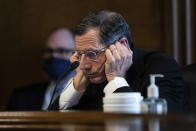 Senator John Barrasso, R-WY, listens to Rep. Deb Haaland, D-N.M., during a confirmation hearing before the Senate Committee on Energy and Natural Resources hearing on her nomination to be Interior Secretary, Tuesday, Feb. 23, 2021 on Capitol Hill in Washington. (Graeme Jennings/Pool via AP)